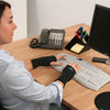 Image of IMAK SmartGlove ergonomic wrist support worn while typing for carpal tunnel and arthritis relief