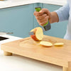 Image of Multi Purpose Food Preparation Board for One Handed Cooking slicing apple on wooden board with fixed spike holder