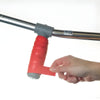 Image of Non Slip Grip Tape for Handles, Tools, and Mobility Aids red wrap applied to metal handlebar for improved grip
