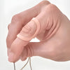 Image of Oval 8 Finger Splint Kit for PIP and DIP Joint Support worn on finger demonstrating joint positioning and alignment