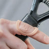 Image of Oval 8 Finger Splint Kit for PIP and DIP Joint Support worn on finger while gripping handle for stability support