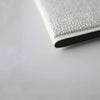 Image of Wireless Foldable Floor Sensor Mat Kit with 6 Channel Monitor close up of textured foldable grey floor sensor mat edge