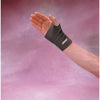 Image of Black carpalgard wrist wrap worn on the wrist and hand
