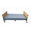 Image of K-Dee II king single electric bed lying flat with beech wood grain ends and optional grey mattress