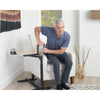 Image of Man using the Assist-A-Tray handle to stand up from an armchair