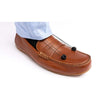 Image of Saebostep drop foot brace cord clipped to a leather loafer
