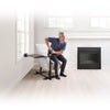 Image of Man using the assist handle to stand up from his armchair