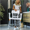 Image of Woman adjusting a white king shower seat with armrests