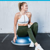 Image of Woman sitting on a bosu pro balance trainer half ball