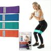 Image of Woman squatting with a THERABAND glute band loop above the knees