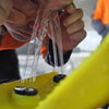 Image of Worker flushing eyes at an AEROWASH portable gravity eyewash station