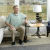 Image of STANDER Omni Swivel Tray Bamboo Table Model Using Stand Assist