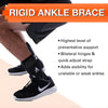 Image of Active Ankle T2 Rigid Hinged Ankle Brace for Sports Support black brace worn with sneaker side view