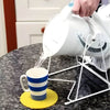 Image of Dycem Round Non Slip Grip Pad for Tables & Trays yellow pad preventing mug sliding while pouring hot water
