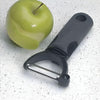 Image of Easy Grip Y-Shaped Vegetable Peeler beside green apple on kitchen surface