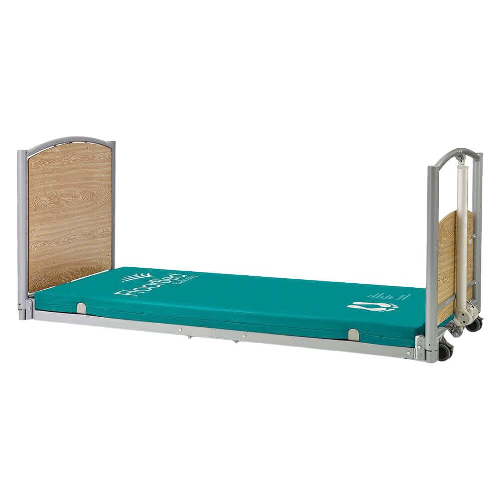 Electric Adjustable Floor Bed for Home and Community Care low height bed with teal mattress and wooden end panels