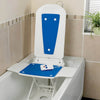 Image of Electric Reclining Bath Lift Seat with Hand Controller installed in bathtub with blue seat pad and remote