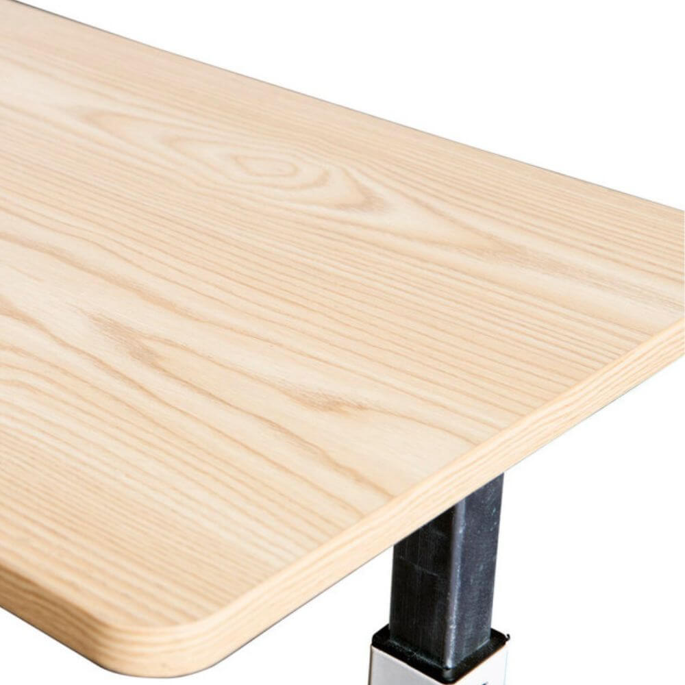 King Overbed Table with Spring Lift 90 x 39cm close-up of natural wood grain tabletop corner