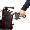 Image of Lightweight Folding Transit Wheelchair with Attendant Brakes red handle close up with brake lever
