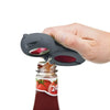 Image of Multi-Function Jar Opener 6-in-1 Bottle, Can & Jar Opening Tool removing twist cap from sauce bottle