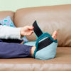 Image of Person Putting on Green Sheepskin Heel Protector