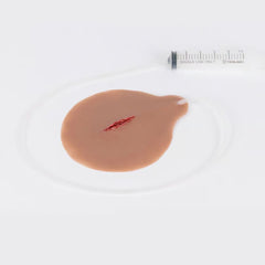 Self-Adhesive Bleeding Stab Wound Simulation for Trauma Training