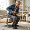 Image of Sit to Stand Assist T Handle Walking Stick elderly man using adjustable cane with quad base indoors