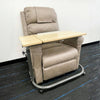 Image of Tilting Over Bed Table with Gas Lift 79 x 39cm positioned over recliner chair for seated user