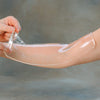 Image of Aquaplast thermoplastic splinting material turning translucent as it is moulded on the forearm