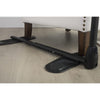 Image of Assist-A-Tray adjustable base under armchair legs