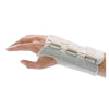 Image of Beige rolyan d-ring wrist splint with padded straps on a right wrist