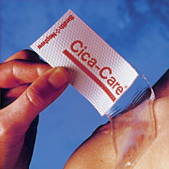 Cica-care silicone gel scar sheet being applied to a shoulder scar