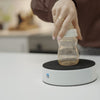 Image of Easy-Up kitchen aid holding a bottle firmly on the bench for one-handed opening
