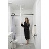 Image of Floor to ceiling grab bar installed beside the toilet in a bathroom