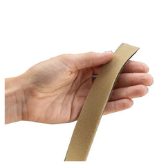 Hand holding rolyan neoprene strapping material for splints