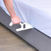 Image of Hand using a mattress lifter to raise the edge of a mattress while making the bed