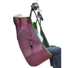 Image of Mesh universal hoist sling with head support and green binding, man seated in the sling on a hoist, side view