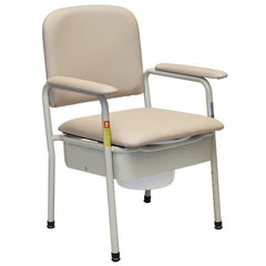 Padded bedside commode chair in beige vinyl with armrests and concealed pail