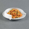 Image of Plate guard for one handed eating holding a pasta meal on the plate