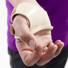 Rolyan ezeform beige thermoplastic thumb splint on the hand