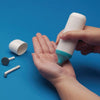 Image of Rolyan mini massager in use on the palm of a hand