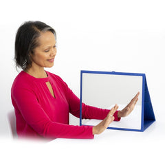 Saebo mirror box folding mirror therapy in use at a table