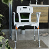 Image of White king shower chair with cutout in a bathroom