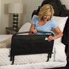 Image of STANDER Collapsible Safety Bed Rail 30 Inch wiht Pouch Woman Placing Remote Control