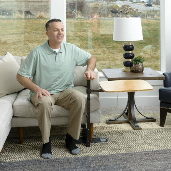 STANDER Omni Swivel Tray Bamboo Table Model Using Stand Assist